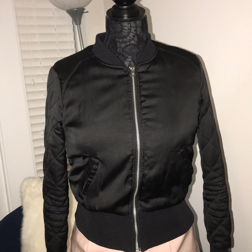 Women’s bomber with quilted sleeve detail.